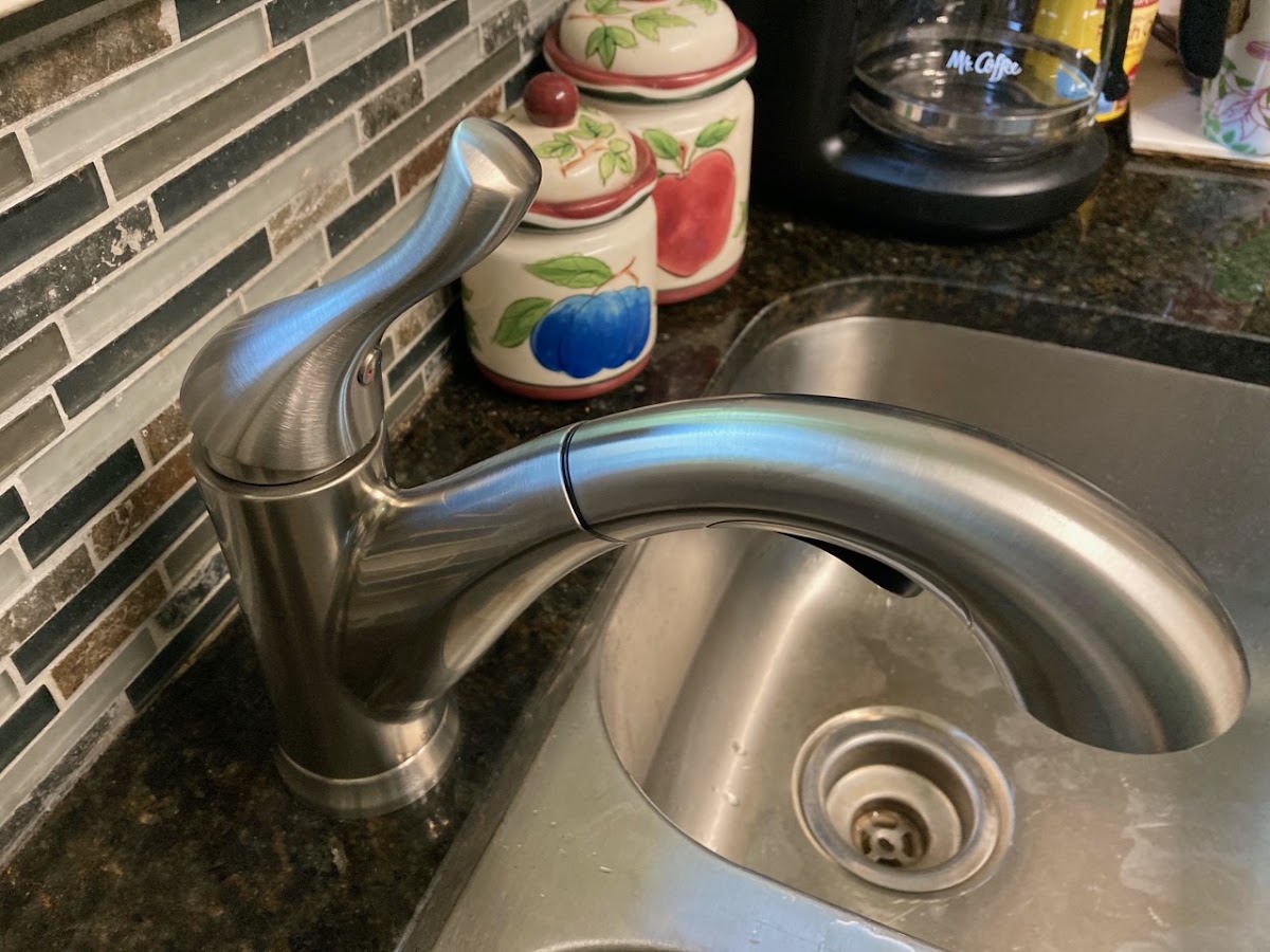 New pull-down kitchen faucet on a granite counter